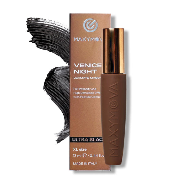Maxymov Venice Night Ultra Black mascara tube with a metallic rose gold cap, shown next to its brown cardboard packaging box and a black mascara brush stroke on a white background.