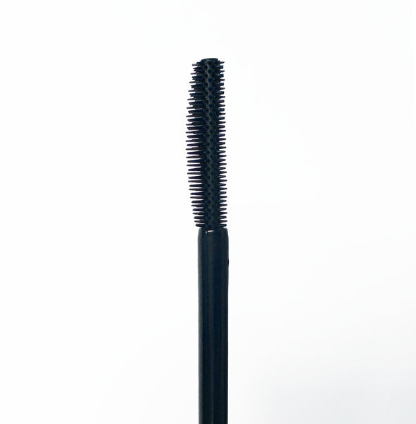 A black cosmetic applicator wand, likely for mascara or eyebrow pomade, shown vertically against a plain white background.